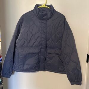 Slightly cropped blue jacket